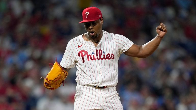 Philadelphia Phillies pitcher Gregory Soto reacts after striking out Los...