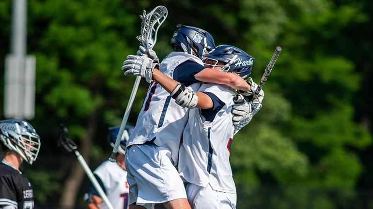 Cold Spring Harbor players celebrate winning in the state Class D...