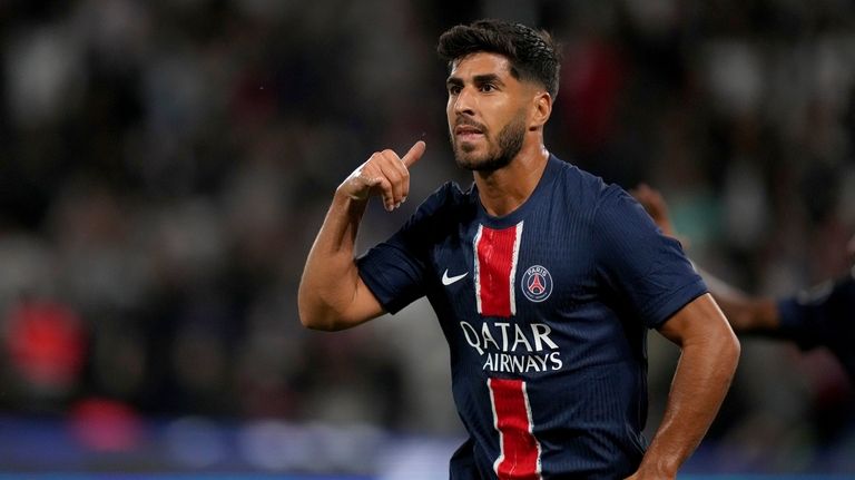 PSG's Marco Asensio celebrates after scoring his side's second goal...