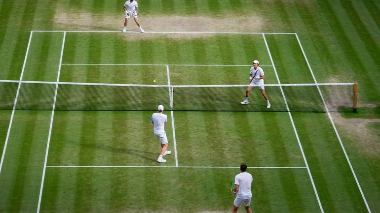 Australia's Max Purcell and compatriot Jordan Thompson, top, in action...