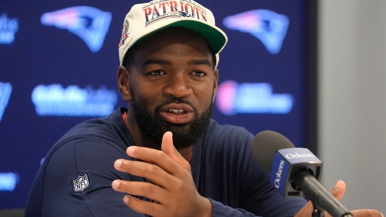 New England Patriots quarterback Jacoby Brissett faces reporters during an...