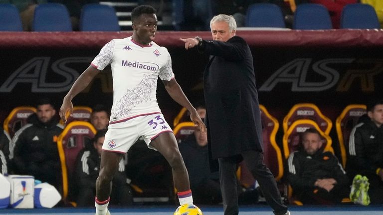 Roma's head coach Jose Mourinho, right, gives instructions during the...