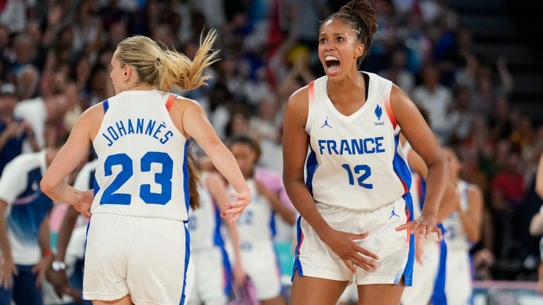 Iliana Rupert (12) and Marine Johannes (23), of France, celebrate...