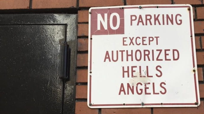 A sign near the front door of the Hells Angels...