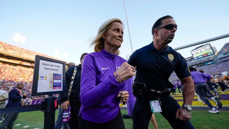 LSU national champion women's basketball head coach Kim Mulkey runs...