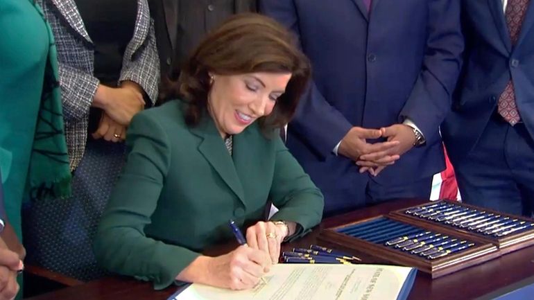 Gov. Kathy Hochul signs a bill in December 2023 to...