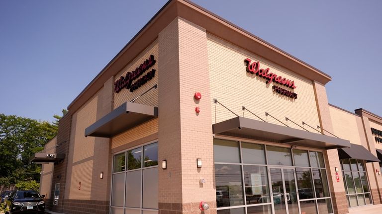 A Walgreens pharmacy store is seen in Deerfield, Ill., Thursday,...