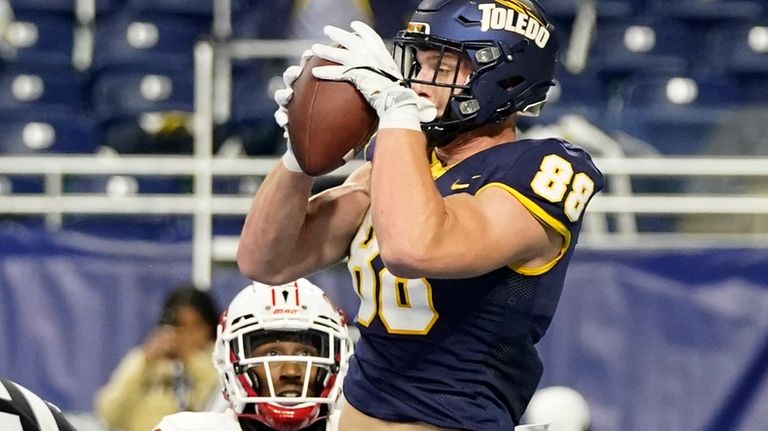 Toledo tight end Anthony Torres (88), defended by Miami (Ohio)...