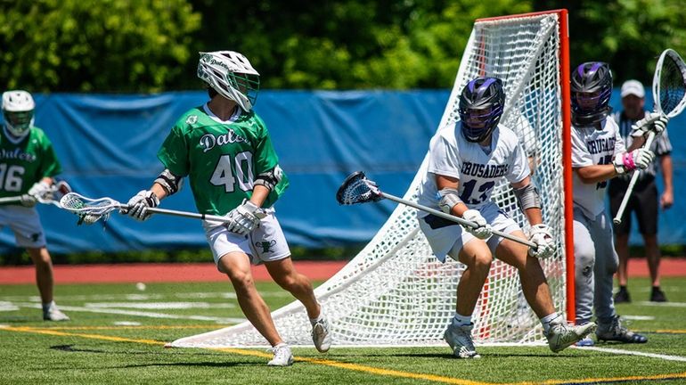 Farmingdale's Brendan O'Keefe, left, looks to pass the ball during...