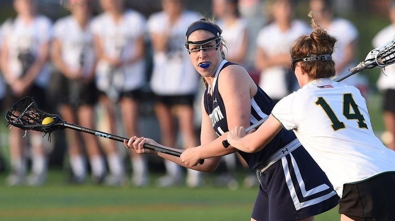 Smithtown West's Grace Langella looks to pass guarded by Ward...