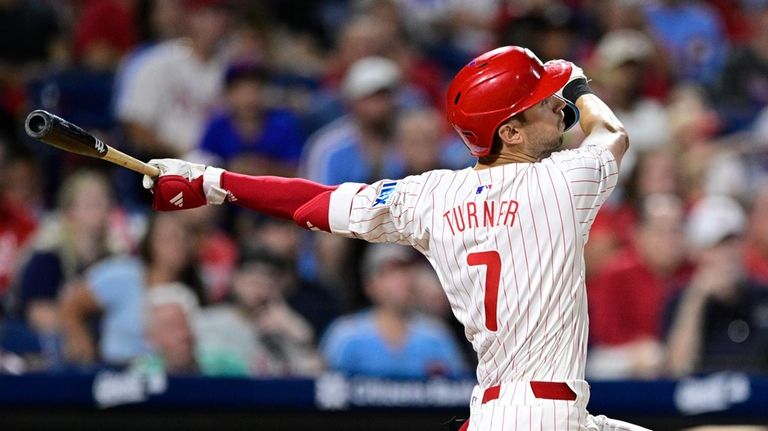 Philadelphia Phillies' Trea Turner watches his solo home run off...