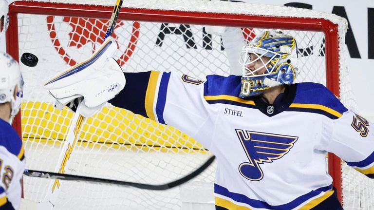 St. Louis Blues goalie Jordan Binnington (50) stops a shot...