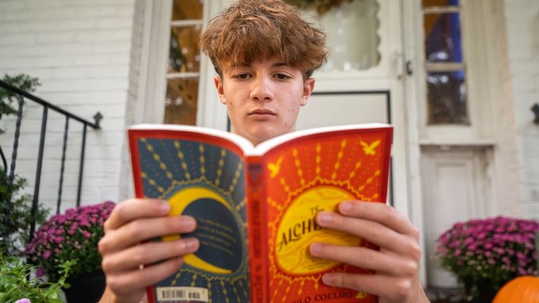 Chris Stanislawski, 14, poses for a portrait outside of his...