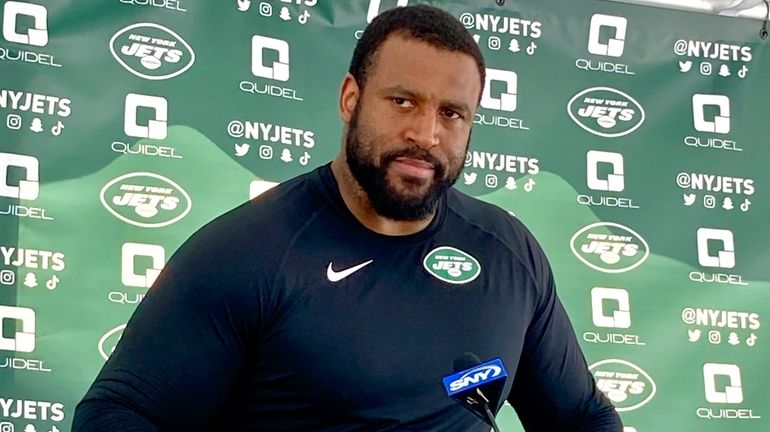 Jets offensive tackle Duane Brown speaks to reporters at the team's...