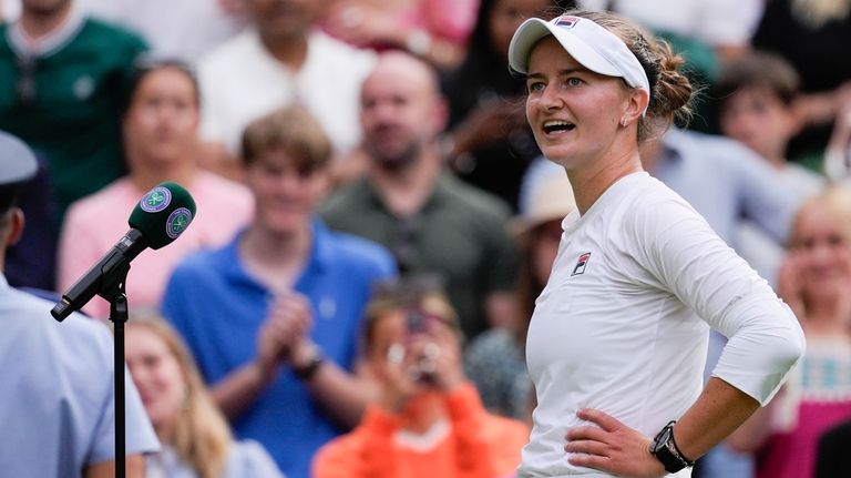 Barbora Krejcikova of the Czech Republic reacts after defeating Elena...