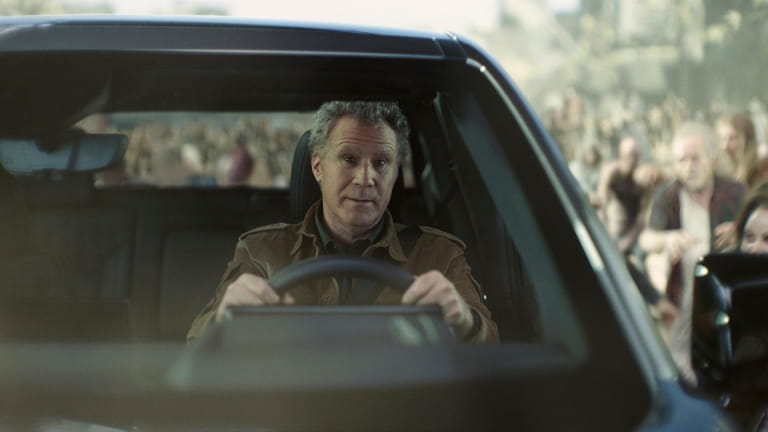 This photo provided by Netflix/GM, Will Ferrell drives a GMC...
