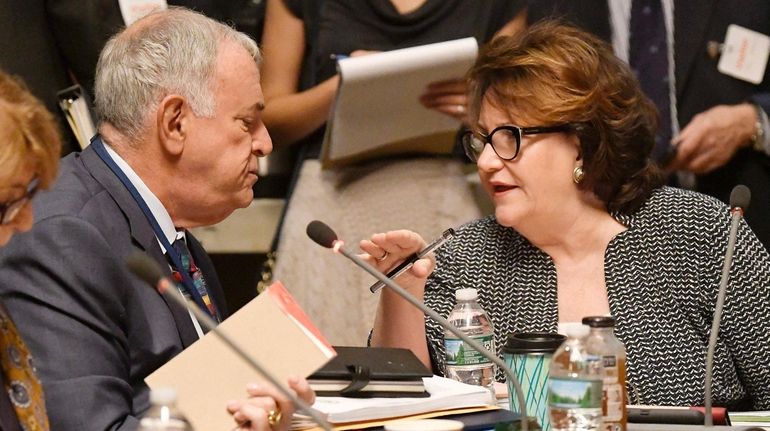 Regent Roger Tilles of Great Neck, left, who represents Long...