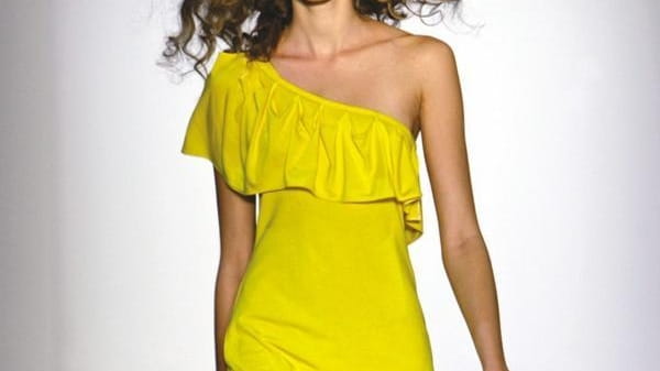 A yellow jersey dress by Luca Luca can be found...