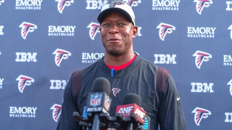 Atlanta Falcons' head coach Raheem Morris speaks at a news...