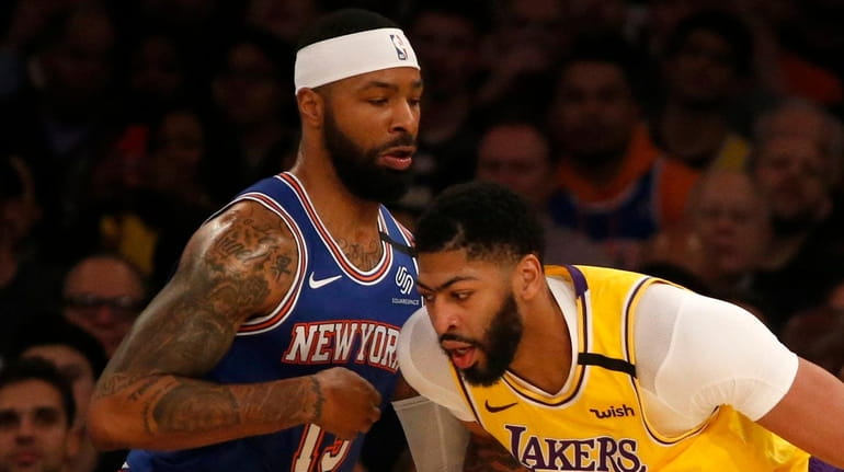 Marcus Morris of the Knicks defends Anthony Davis of the Los Angeles Lakers...