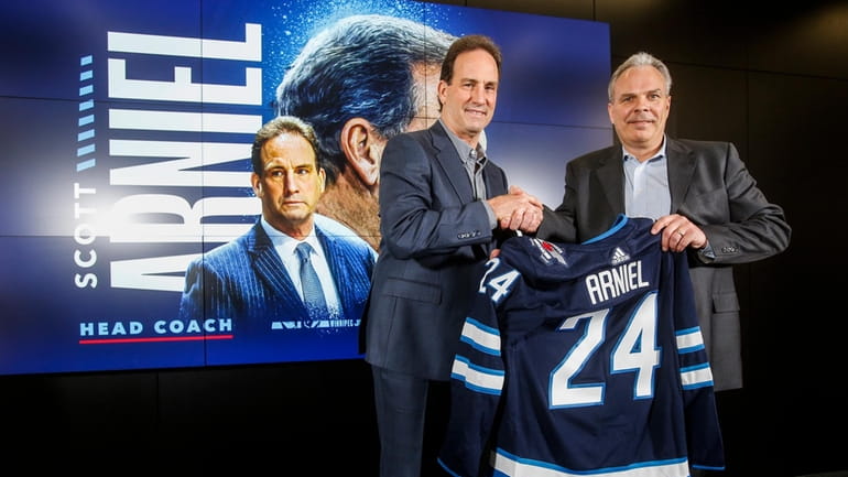Winnipeg Jets General Manager Kevin Cheveldayoff, right, and head coach...