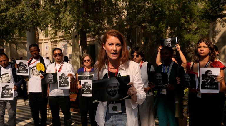 Joey Shea, of Human Rights Watch, speaks during a demonstration...