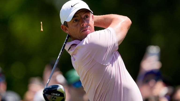 Rory McIlroy, of Northern Ireland, watches his tee shot on...