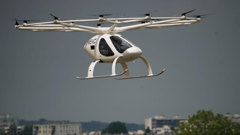 The Volocopter 2X, an electric vertical takeoff and landing multicopter,...