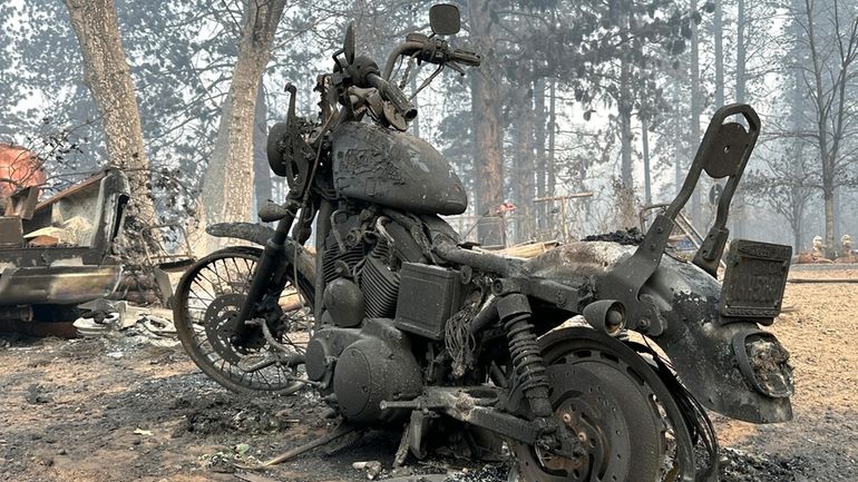 A charred motorcycle is seen in aftermath of the Park...