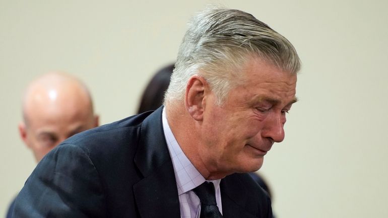 Actor Alec Baldwin reacts during his trial for involuntary manslaughter...