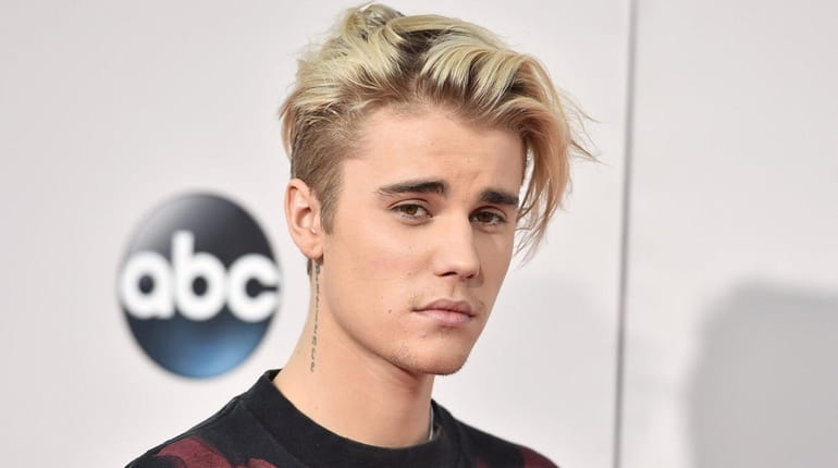 Justin Bieber arrives at the American Music Awards at the...