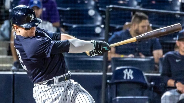 The Yankees' Harrison Bader hits a sacrifice fly to score a...