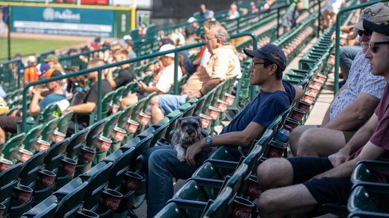 Charles Chou, of Queens, brought his dog, Maggie, to the...