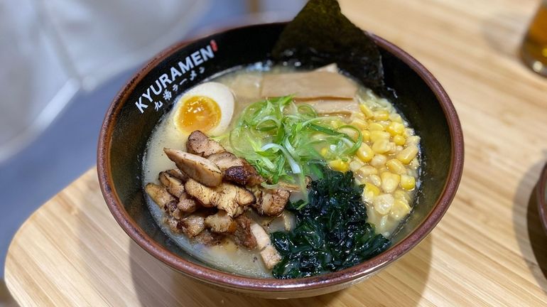 Chicken ramen is layered with fresh corn, wakame seaweed and...