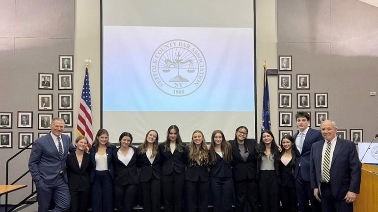 A mock trial team from Ward Melville High School in...