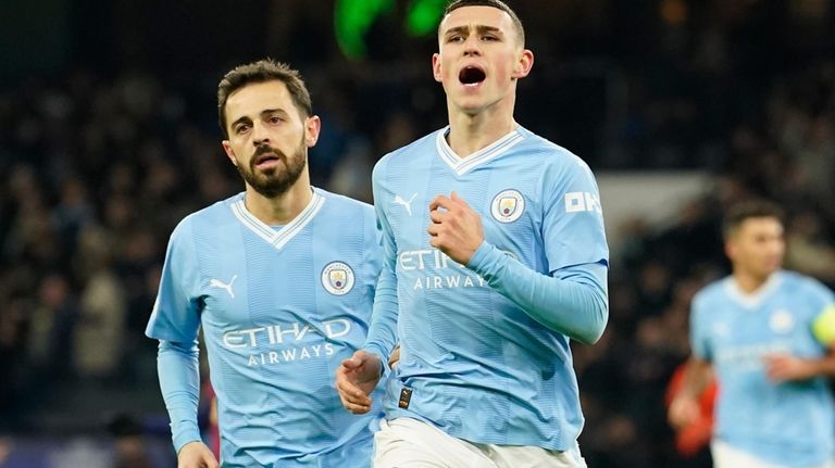 Manchester City's Phil Foden celebrates after scoring his side's second...