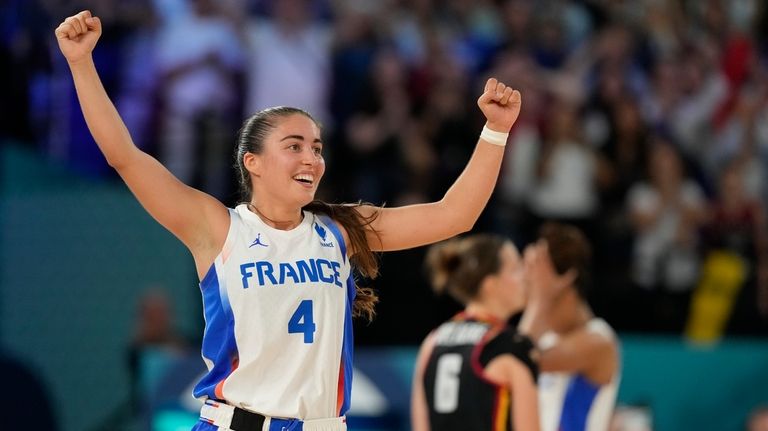 Marine Fauthoux (4), of France, celebrates after France beat Belgium...