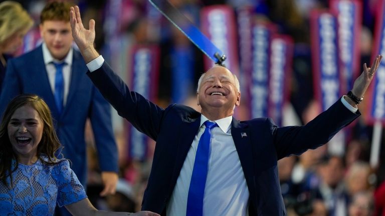 Democratic vice presidential nominee Minnesota Gov. Tim Walz reacts during...