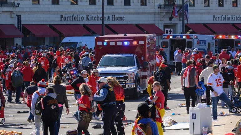 Police clear the area following a shooting at the Kansas...