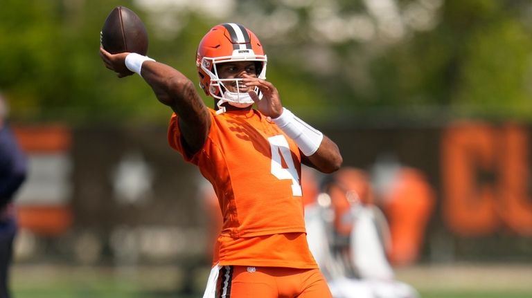 Cleveland Browns quarterback Deshaun Watson throws during an NFL football...