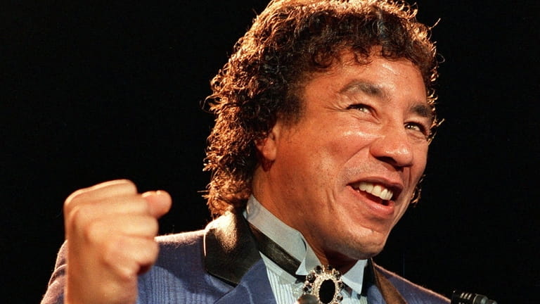 Smokey Robinson smiles after being inducted into the Rock & Roll...