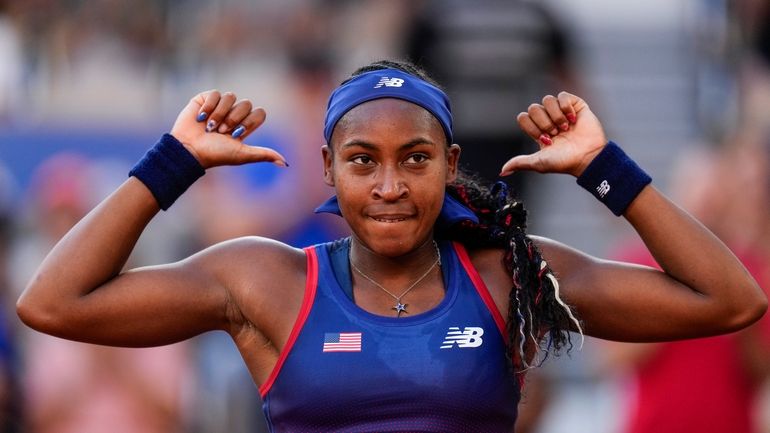 Coco Gauff of United States celebrates her victory over Ajla...