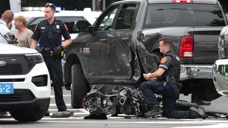 Suffolk police at the scene of a fatal motorcycle crash Thursday...