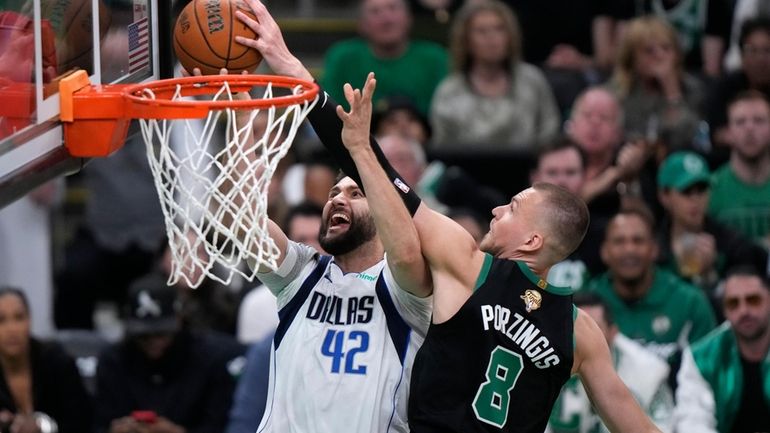 Boston Celtics center Kristaps Porzingis (8) blocks a shot by...