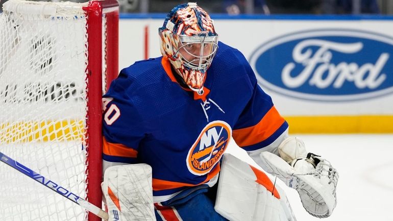 Islanders goaltender Semyon Varlamov watches the puck curing the third...