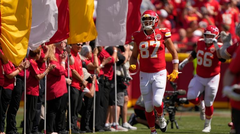 Kansas City Chiefs tight end Travis Kelce (87) runs onto...