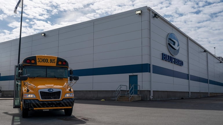 FILE -- An all-electric school bus sits on display in...