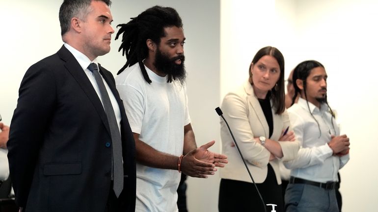 Jamhal Tavon Sanders Latimer, center left, addresses the judge while...