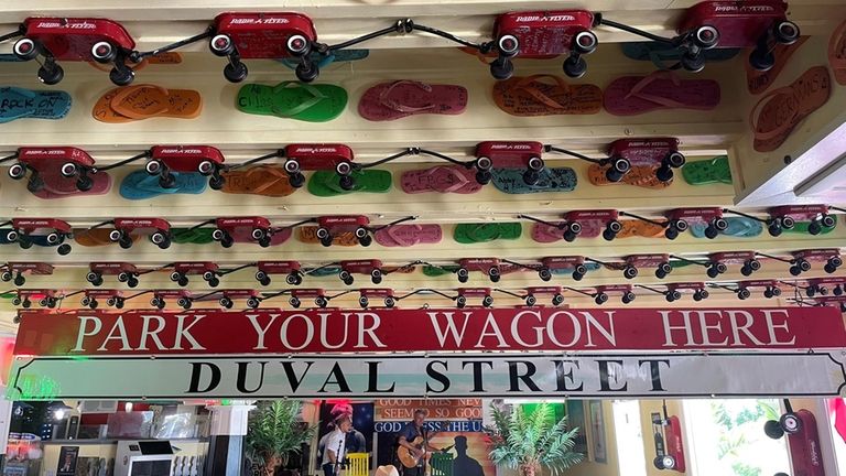 Miniature red wagons hang from the ceiling of the Sandbar...