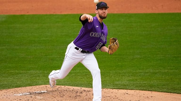 Colorado Rockies relief pitcher Daniel Bard throws against the Kansas...